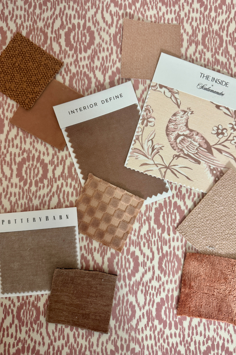 Fabric swatches and design samples on a patterned background